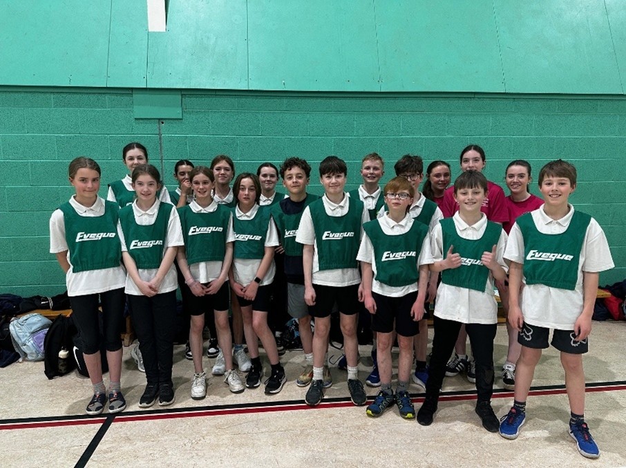 Year 7 students in green bibs at Sports Hall Athletics competition