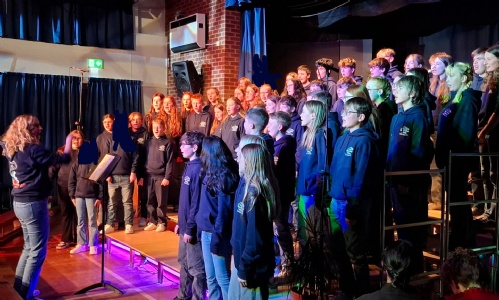 Disney choir performing at school 